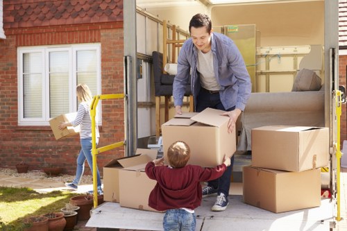 Loading household items into a van in South Kensington