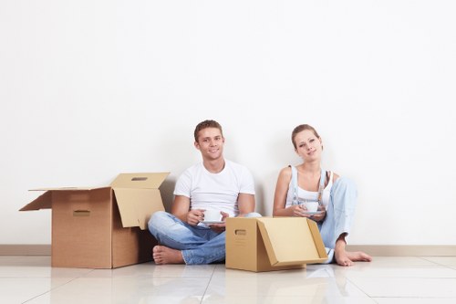 Professional movers loading boxes for a flat move in South Kensington