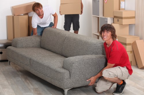 Loading furniture into a van on a South Kensington street