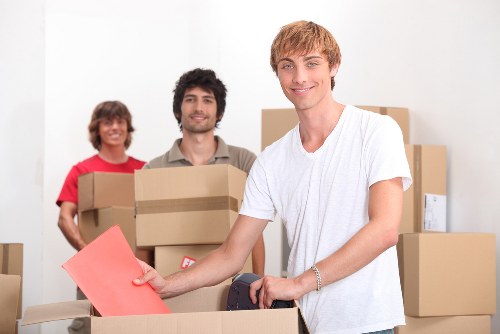 Moving crew handling household items in a South Kensington flat